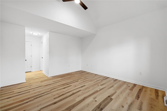 unfurnished room featuring visible vents, baseboards, lofted ceiling, ceiling fan, and wood finished floors