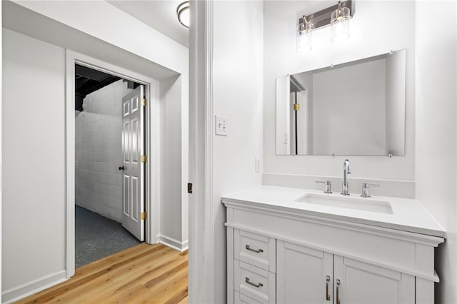 bathroom featuring wood finished floors and vanity