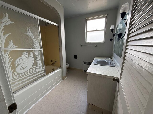 705 E 18th Ave, Munhall, PA 15120 - full bath featuring radiator heating unit, vanity,  shower combination, toilet, and baseboards