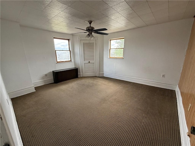 705 E 18th Ave, Munhall, PA 15120 - carpeted spare room featuring radiator, healthy amount of natural light, a ceiling fan, and baseboards