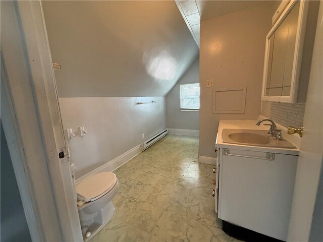 705 E 18th Ave, Munhall, PA 15120 - bathroom featuring a baseboard radiator, vaulted ceiling, vanity, toilet, and backsplash
