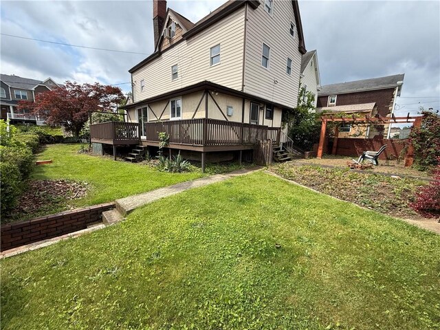 705 E 18th Ave, Munhall, PA 15120 - back of property featuring a deck, a lawn, a chimney, and a pergola