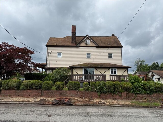 705 E 18th Ave, Munhall, PA 15120 - view of side of home with a wooden deck and a chimney