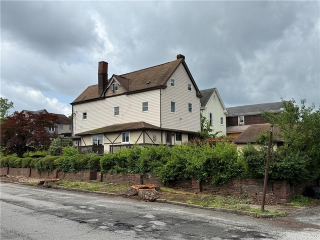 705 E 18th Ave, Munhall, PA 15120 - view of property exterior with a chimney