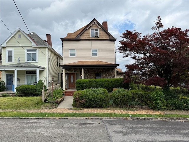 705 E 18th Ave, Munhall, PA 15120 - view of front of home with covered porch and a chimney