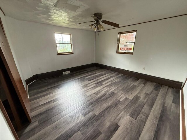 705 E 18th Ave, Munhall, PA 15120 - empty room featuring wood finished floors, ceiling fan, and baseboards