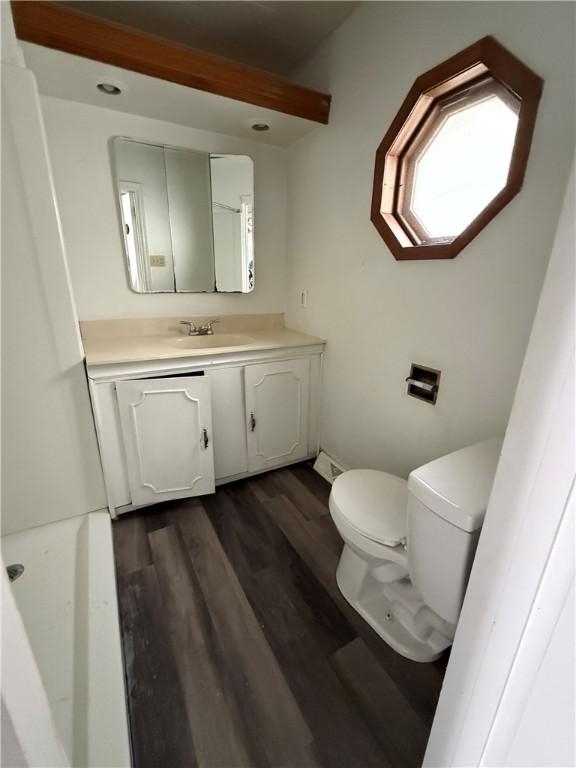 705 E 18th Ave, Munhall, PA 15120 - bathroom with toilet, vanity, and wood finished floors