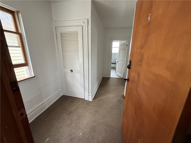 705 E 18th Ave, Munhall, PA 15120 - hall featuring healthy amount of natural light, dark colored carpet, and baseboards
