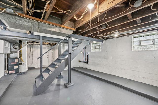below grade area with stairway and heating unit