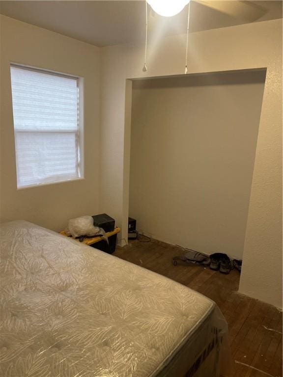 bedroom featuring wood finished floors