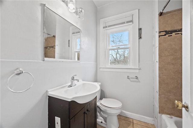 full bathroom with bathtub / shower combination, toilet, vanity, baseboards, and tile patterned floors