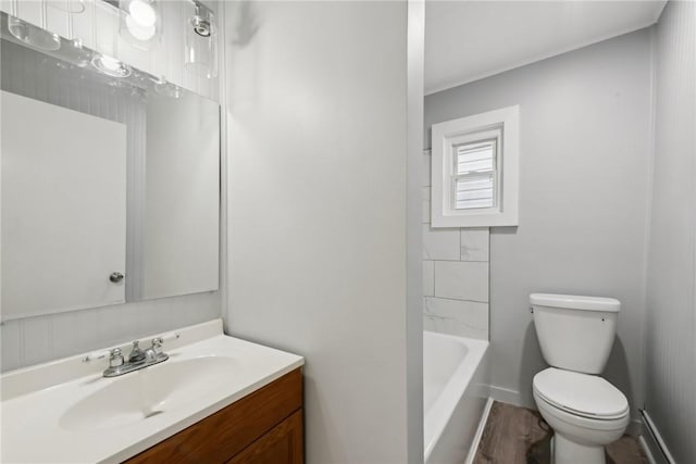 full bath featuring baseboards, toilet, and vanity