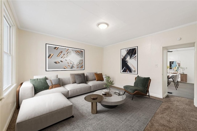 living room with carpet flooring, baseboards, and ornamental molding