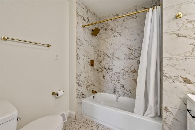 full bath featuring toilet, shower / tub combo, baseboards, and vanity