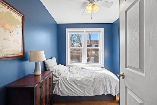 bedroom with ceiling fan and wood finished floors