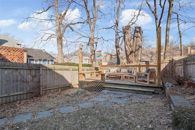 view of yard with a fenced backyard, outdoor lounge area, and a deck