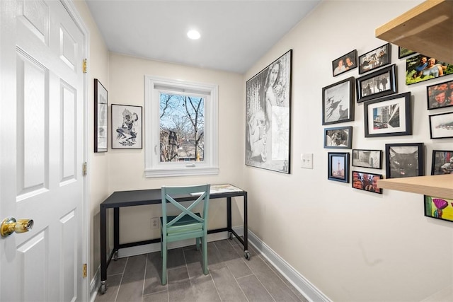 office featuring baseboards and tile patterned floors