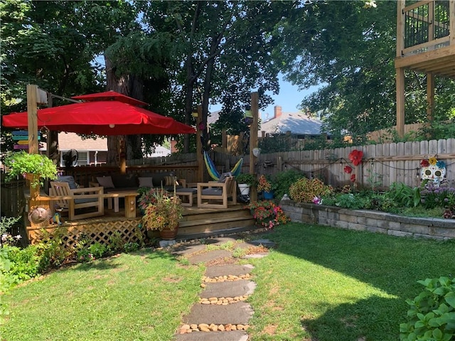 view of yard featuring fence and a wooden deck