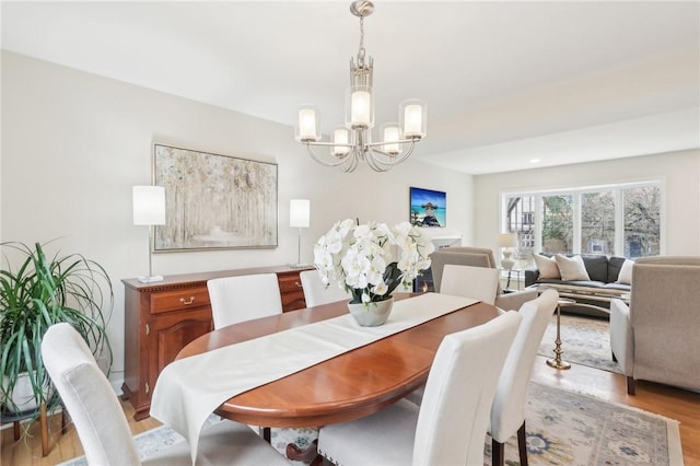 dining room featuring a chandelier and light wood-style floors