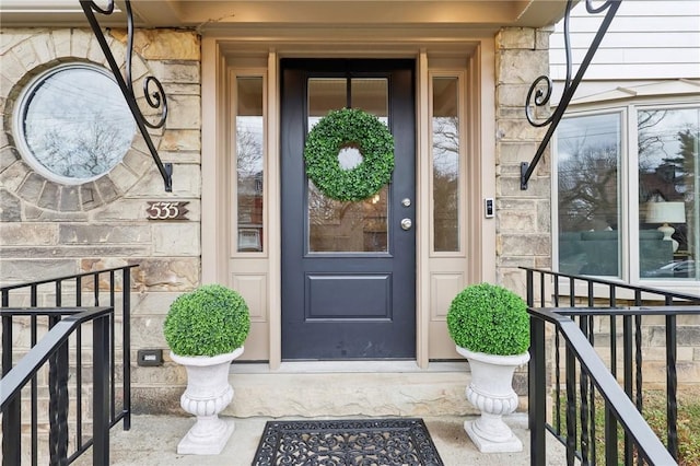 doorway to property with stone siding