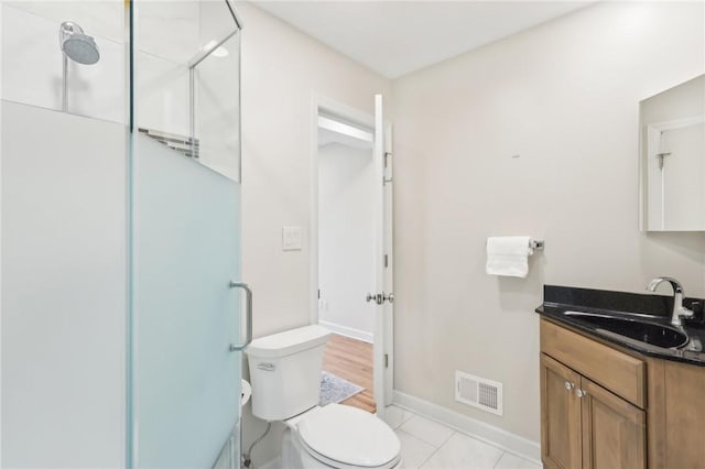 full bathroom with toilet, vanity, visible vents, tile patterned floors, and an enclosed shower