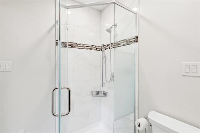 full bath with a shower stall and toilet