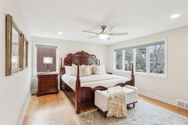 bedroom featuring recessed lighting, a ceiling fan, baseboards, visible vents, and light wood-style floors