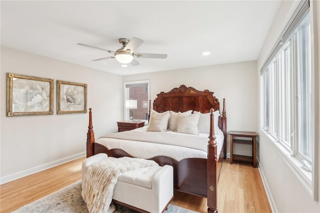 bedroom with light wood-style flooring, baseboards, a ceiling fan, and recessed lighting