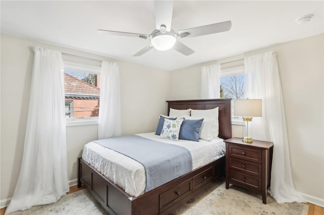 bedroom featuring ceiling fan and baseboards