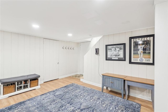 living area featuring wood finished floors and recessed lighting