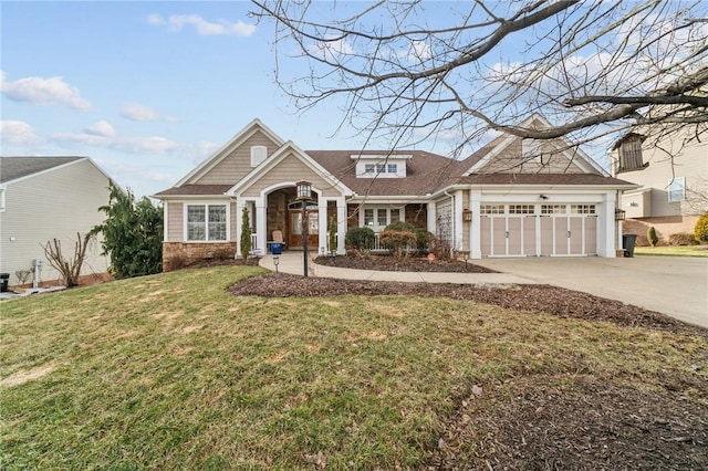 view of front of house with a garage, driveway, stone siding, and a front yard