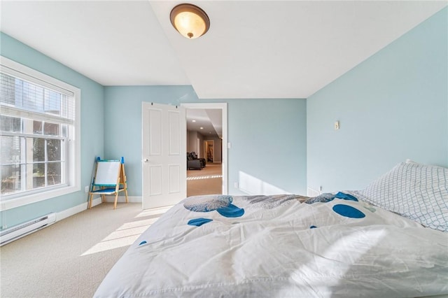 bedroom featuring carpet, a baseboard radiator, and baseboards