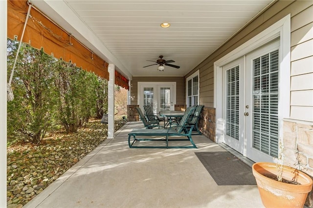 view of patio featuring ceiling fan and french doors