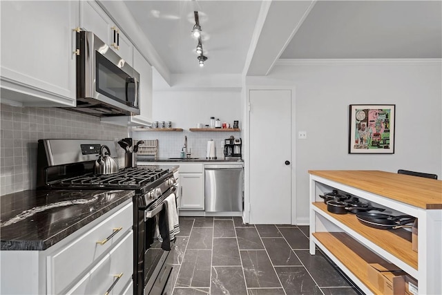 kitchen with open shelves, tasteful backsplash, butcher block counters, appliances with stainless steel finishes, and white cabinets