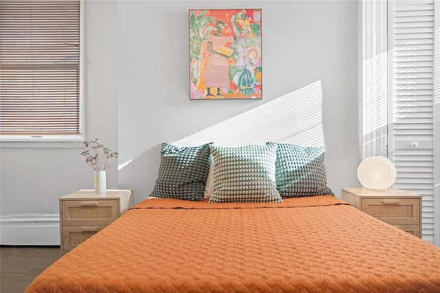 bedroom with wood finished floors