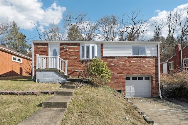 view of front of home with concrete driveway, brick siding, an attached garage, and a front yard