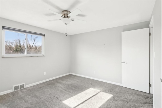 unfurnished bedroom with carpet floors, visible vents, and baseboards