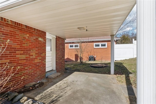 view of patio featuring fence and central AC unit