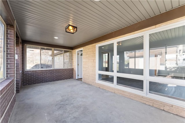 unfurnished sunroom featuring a wealth of natural light