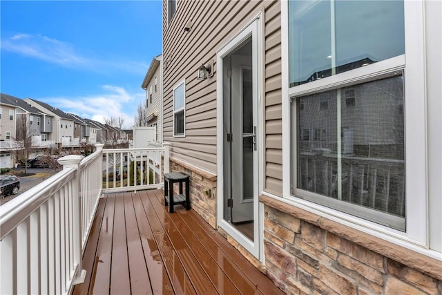 wooden terrace featuring a residential view