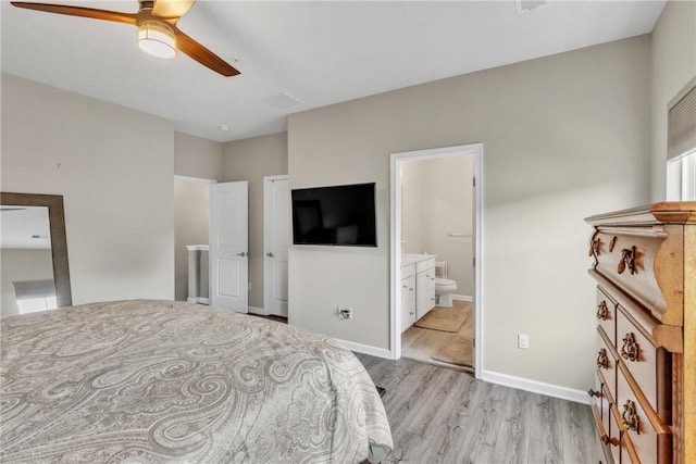 bedroom with ceiling fan, light wood finished floors, connected bathroom, and baseboards