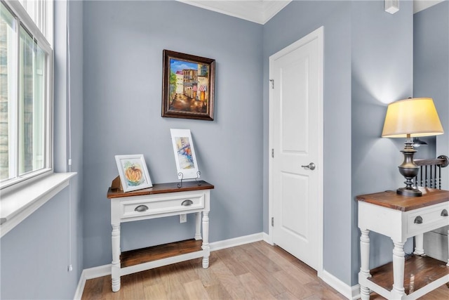 entrance foyer featuring light wood-type flooring and baseboards