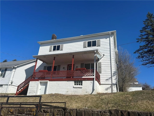 view of front of property featuring fence and a chimney