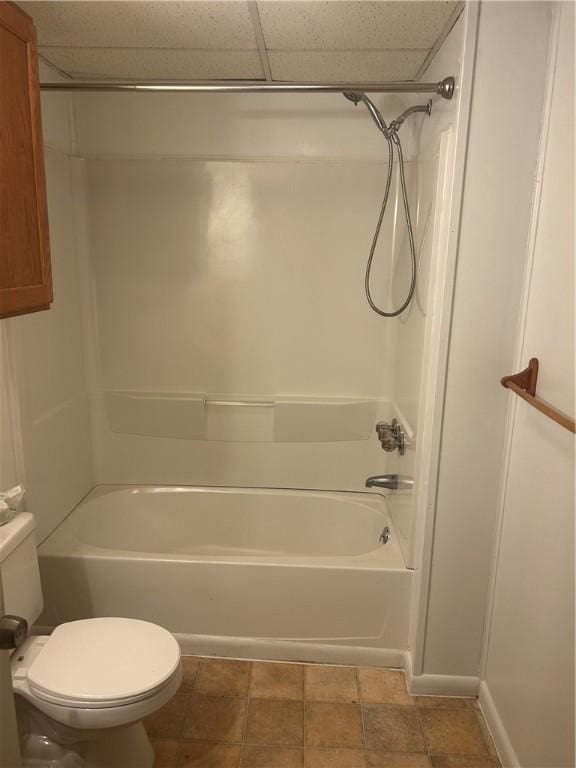 full bath featuring a paneled ceiling, tub / shower combination, and toilet