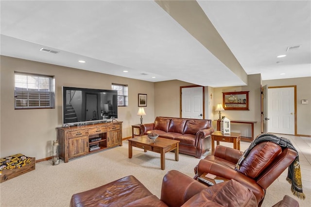 living room with baseboards, light carpet, visible vents, and recessed lighting