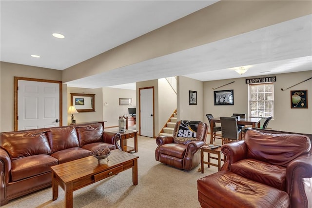 living area with recessed lighting, light carpet, and stairway