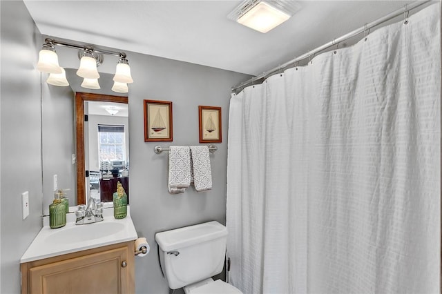 full bathroom with toilet, a shower with curtain, and vanity