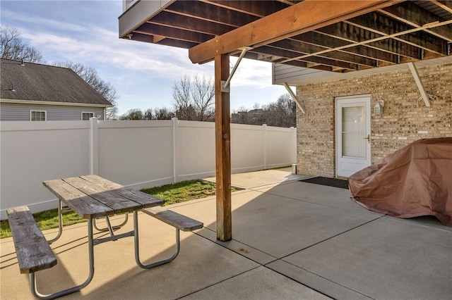 view of patio featuring fence