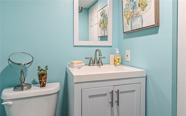 bathroom with toilet and vanity