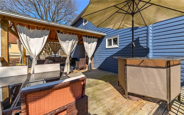 deck with area for grilling and a gazebo